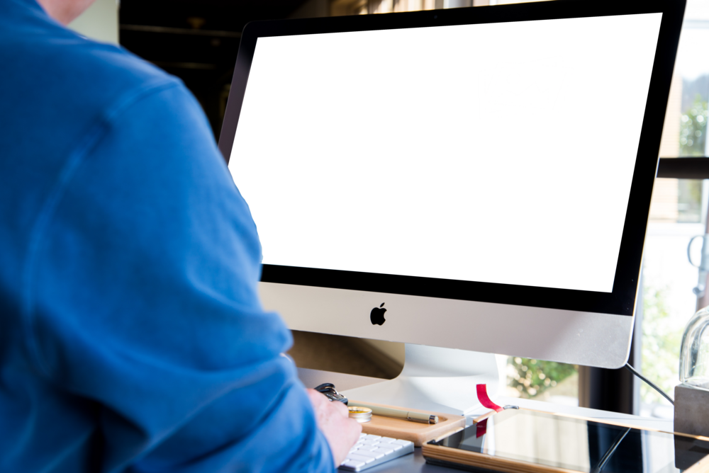 Desktop Mockup: person working on the computer in the office